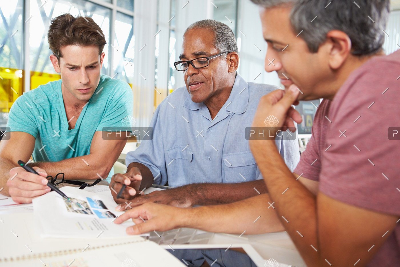 demo-attachment-121-group-of-men-meeting-in-creative-office-PXEKFW4