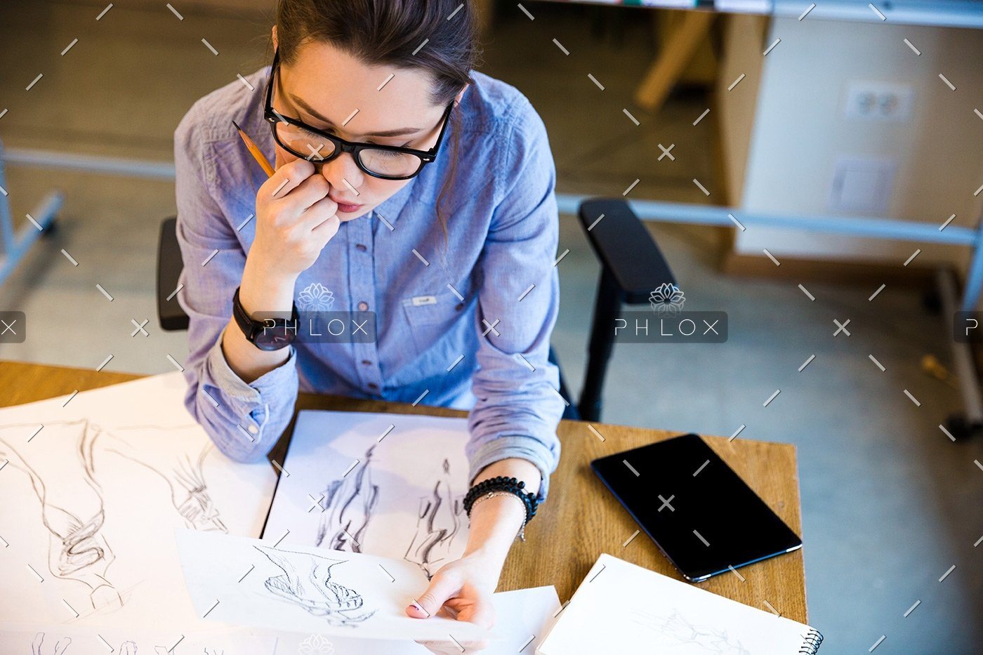 demo-attachment-125-pensive-woman-fashion-designer-sitting-and-PHGZYEM